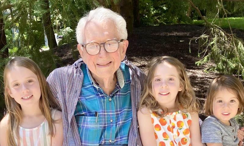 Dr. Eugene Braunwald enjoys a visit in June 2024 from his great-grandchildren, from left, Beni, Elena and Nina, who was named after her great-grandmother Dr. Nina Starr Braunwald. (Photo courtesy of the Braunwald family)